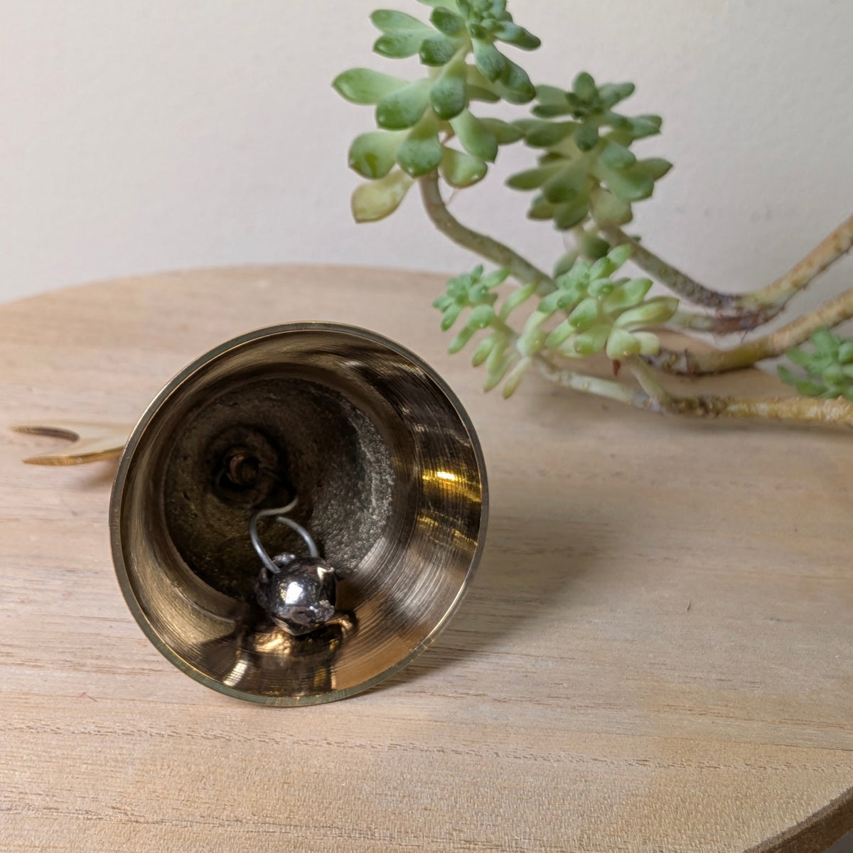Triple Moon brass altar bell, second view, at Ordinary Magic in Savannah, GA.