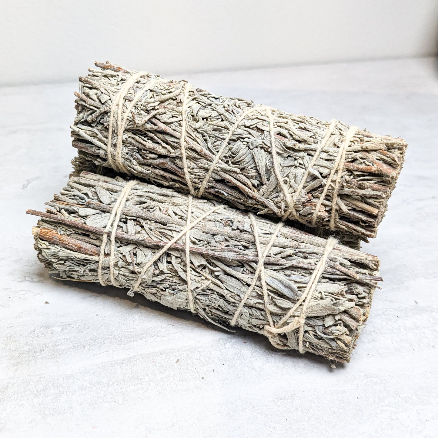 A bundled desert sage burn wand scented with copal.