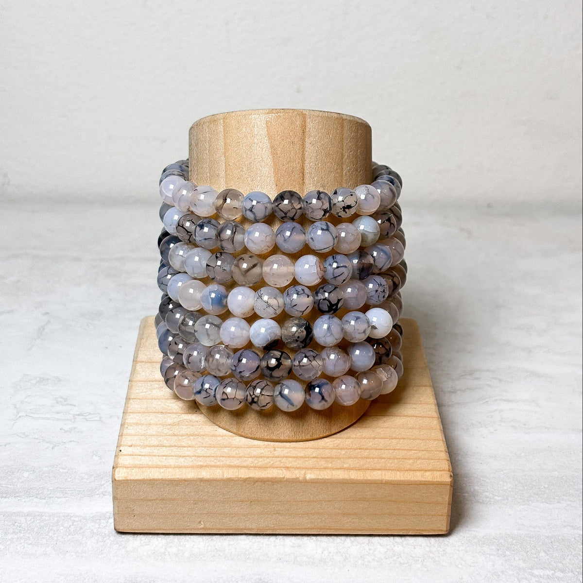 White dragon veins agate beaded bracelet with polished beads and natural dark veining, at Ordinary Magic in Savannah, GA.