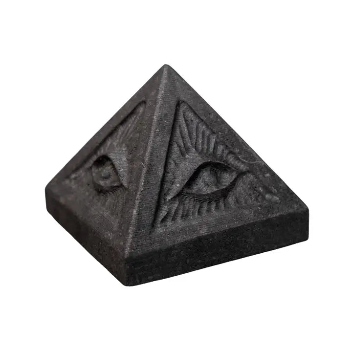 Black shungite pyramid carved with an evil eye on each face