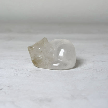 Polished clear quartz, 1", sleeping cat crystal carving, view 9, at Ordinary Magic in Savannah, GA.