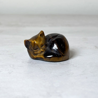 Polished sleeping cat crystal carving, view 5, at Ordinary Magic in Savannah, GA.