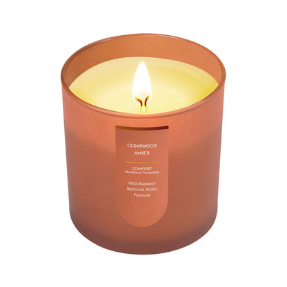 Cue Cedarwood Amber candle — an 8.5 oz jar with a cedarwood and warm amber scent, at Ordinary Magic in Savannah, GA.