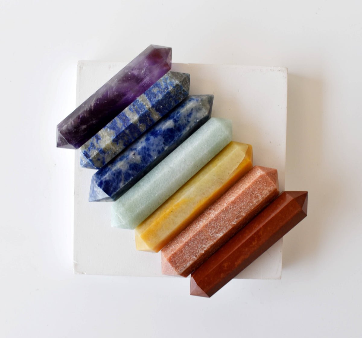 7 chakra double point crystal wands in red jasper, orange, yellow and green aventurine, sodalite, lapis lazuli and amethyst, at Ordinary Magic in Savannah, GA.