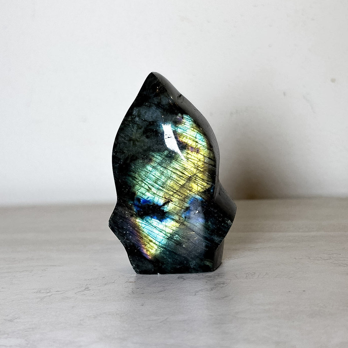 Polished labradorite freeform with blue-gold flash, additional view, at Ordinary Magic in Savannah, GA.