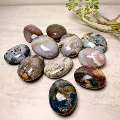 Ocean jasper mini palmstones, polished and rounded with natural orb patterns, at Ordinary Magic in Savannah, GA.
