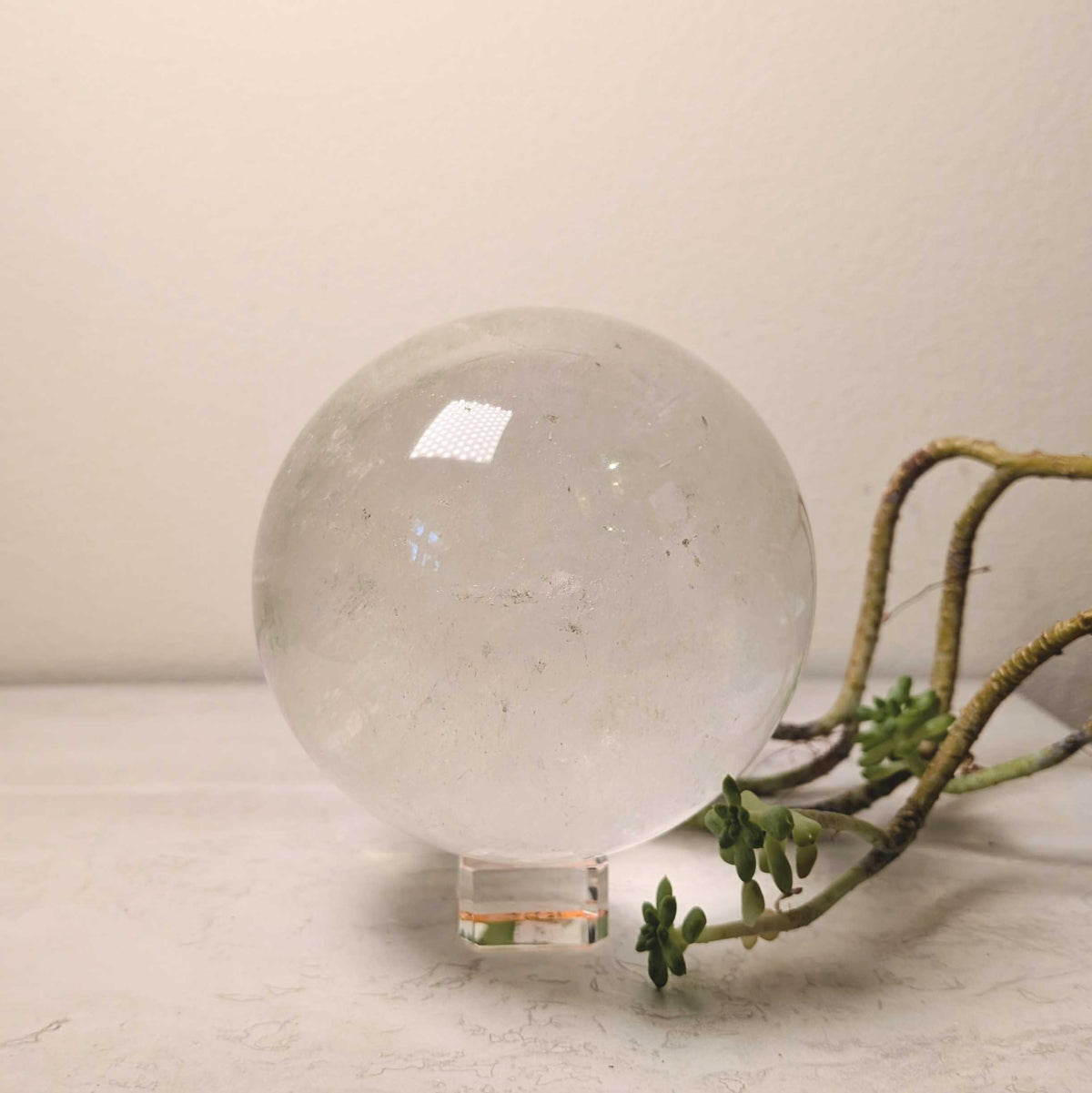 Polished clear quartz crystal sphere, at Ordinary Magic in Savannah, GA.