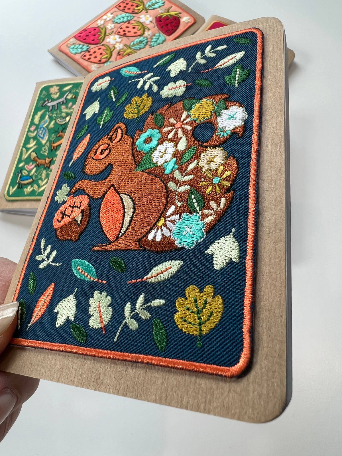 Squirrel embroidery pocket notebook, second view.