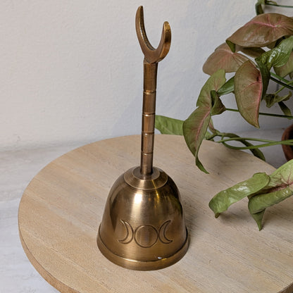 Solid brass Triple Moon altar bell, 5 inches tall, with crescent moon detailing, at Ordinary Magic in Savannah, GA.
