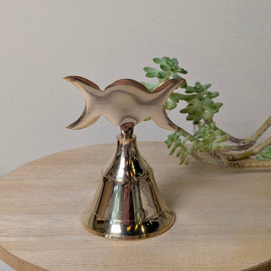 Triple Moon brass altar bell with an engraved waxing, full and waning moon design, at Ordinary Magic in Savannah, GA.