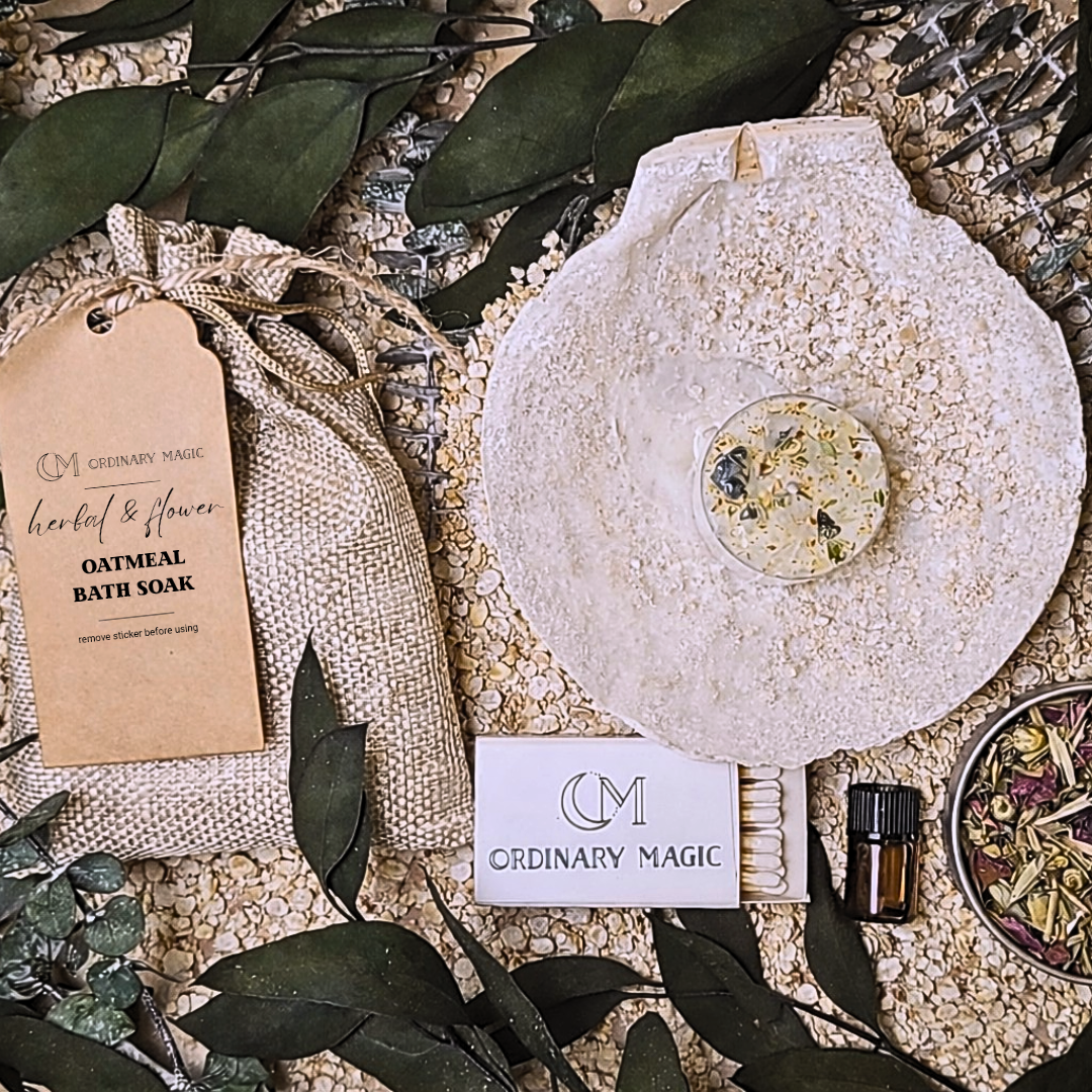 Bath product packaging with 'Ordinary Magic' branding on a natural stone surface with greenery.