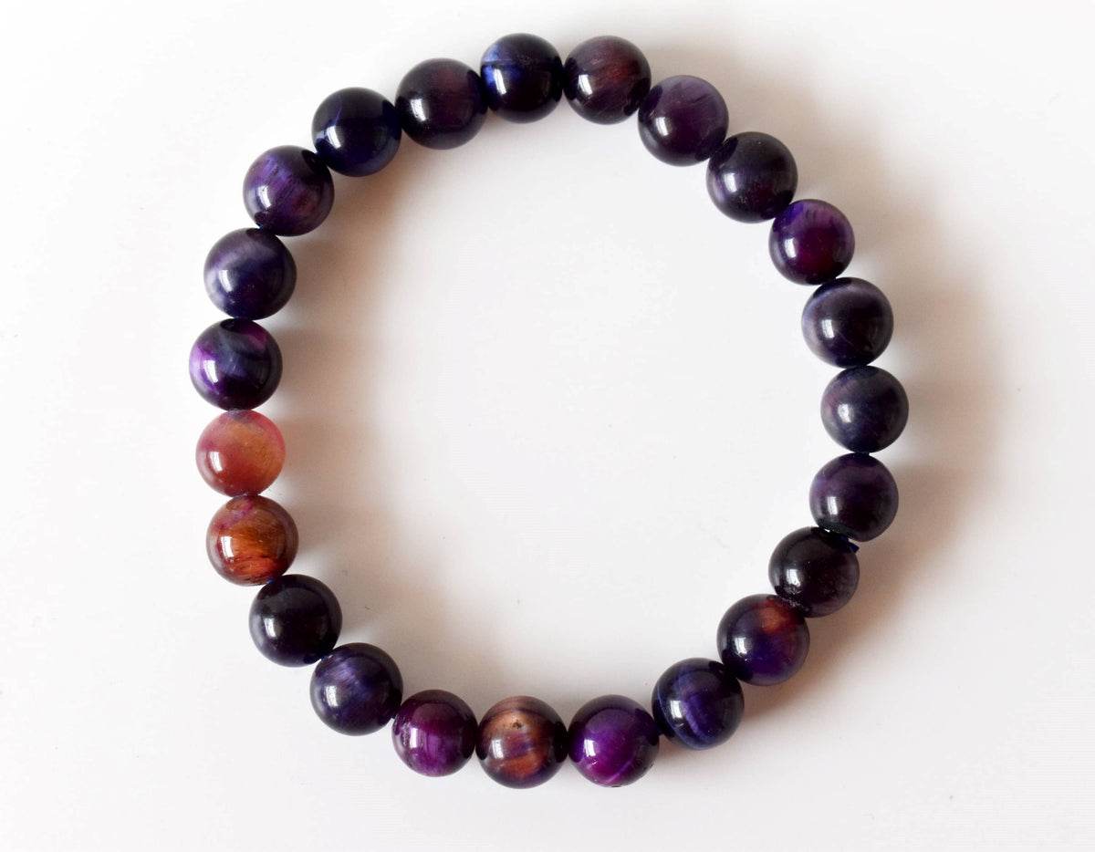 Violet tiger cat's eye beaded bracelet with smooth, polished purple beads, at Ordinary Magic in Savannah, GA.