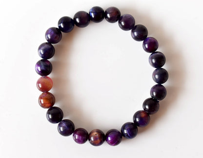 Violet tiger cat's eye beaded bracelet with smooth, polished purple beads, at Ordinary Magic in Savannah, GA.