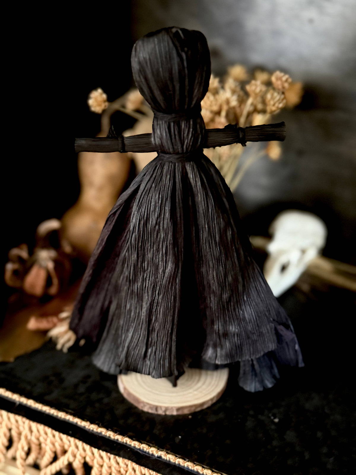 Black corn husk folk poppet, second view, at Ordinary Magic in Savannah, GA.