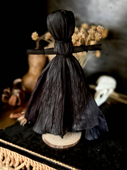 Black corn husk folk poppet, second view, at Ordinary Magic in Savannah, GA.