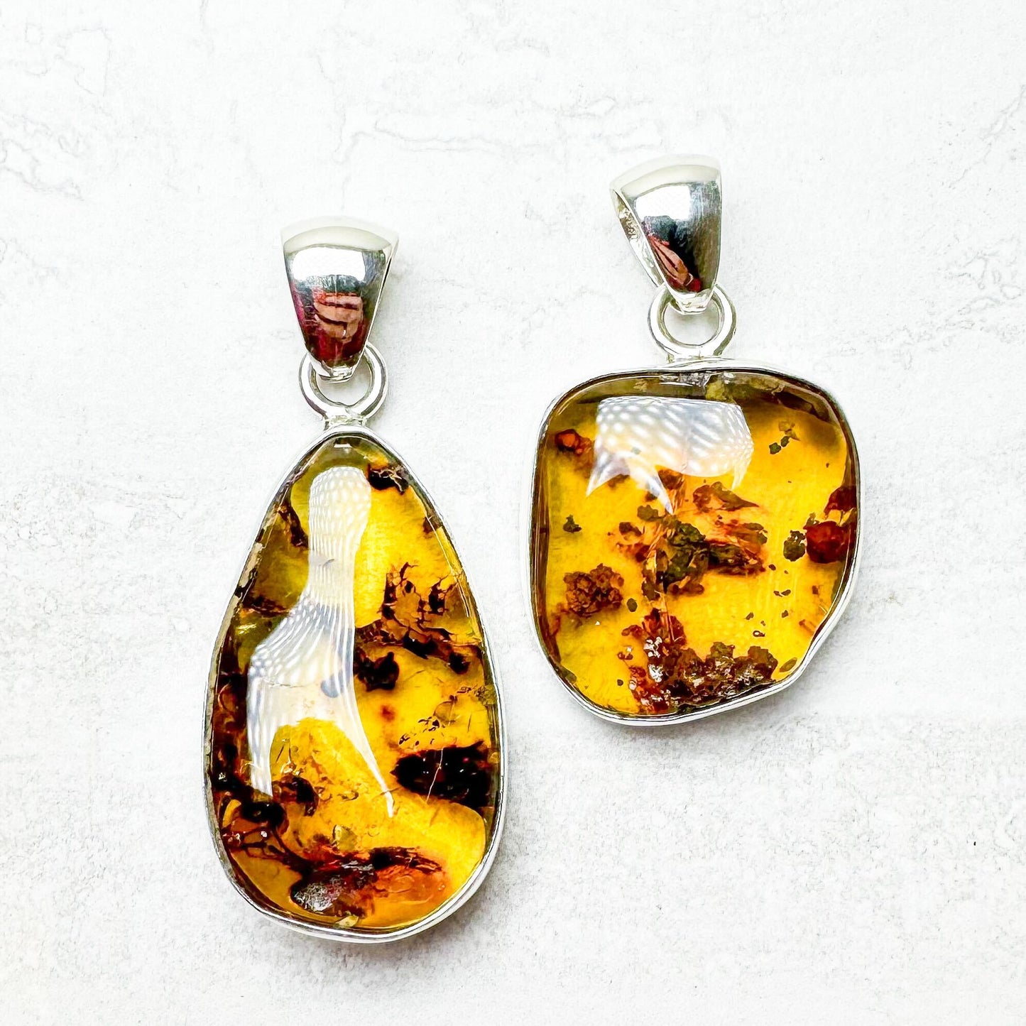 Amber with Silver Pendants