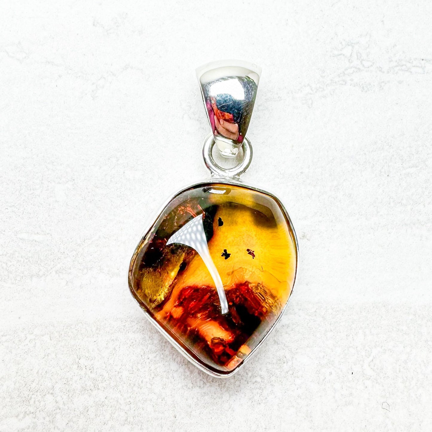 Amber with Silver Pendants