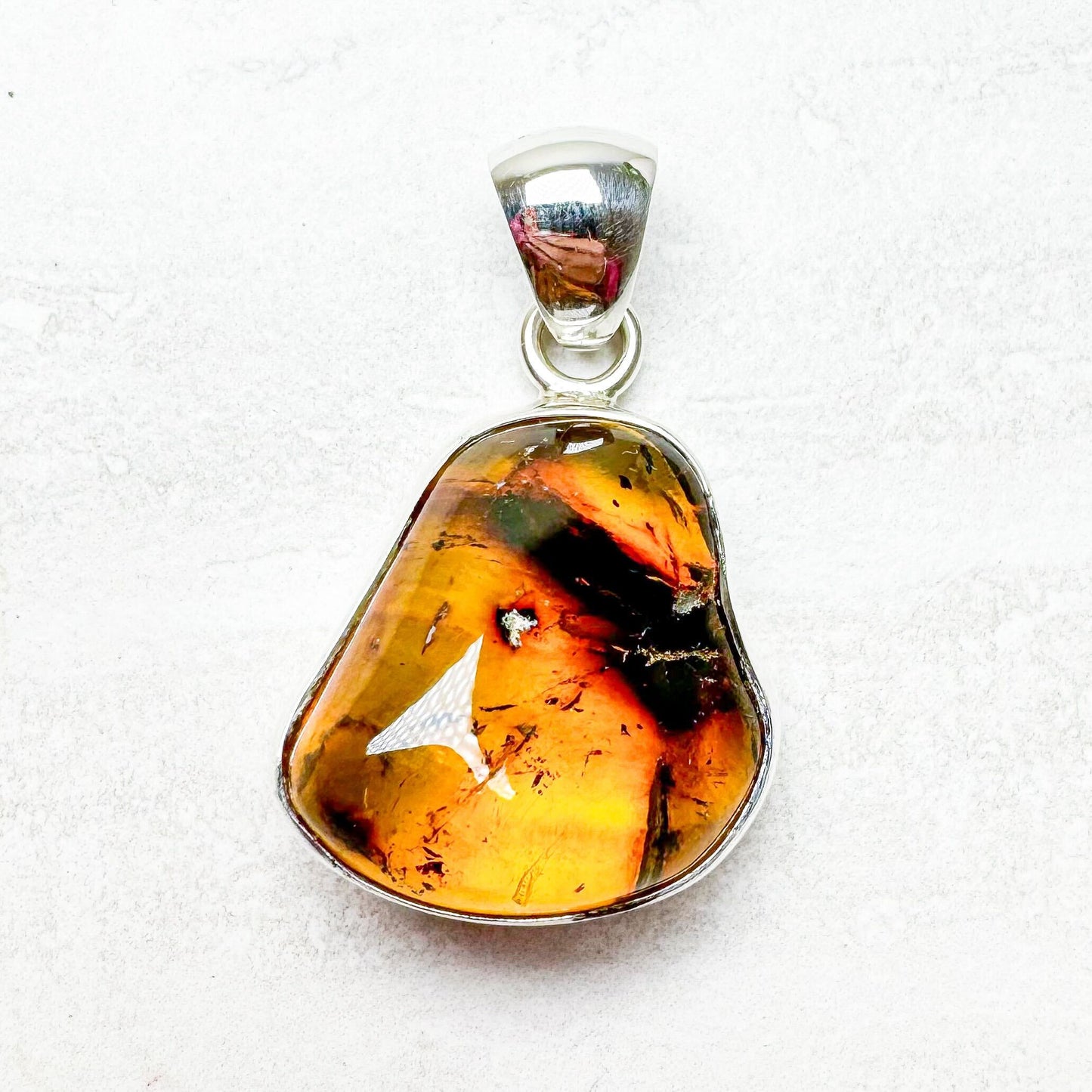 Amber with Silver Pendants