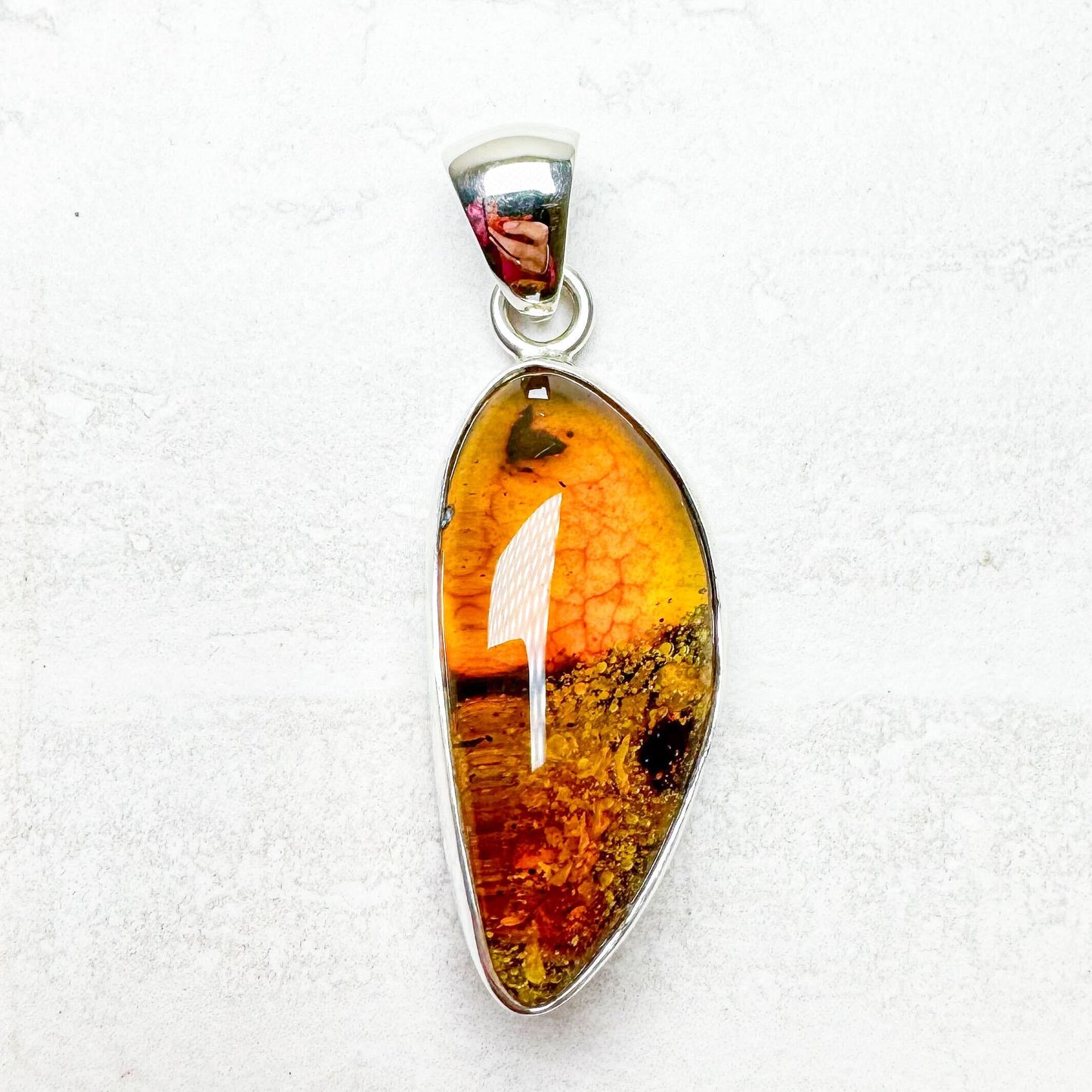 Amber with Silver Pendants