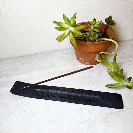 Black wooden incense burner for incense sticks, at Ordinary Magic in Savannah, GA.