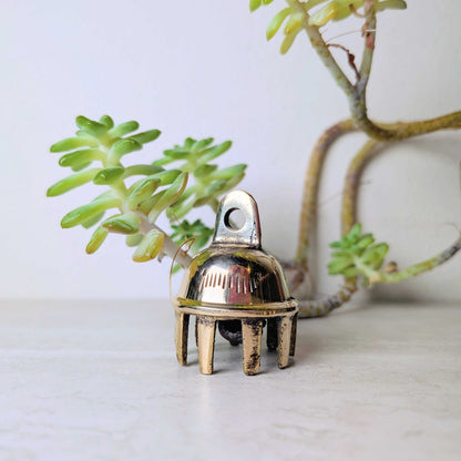 Handcrafted brass bell, one of six assorted designs, at Ordinary Magic in Savannah, GA.