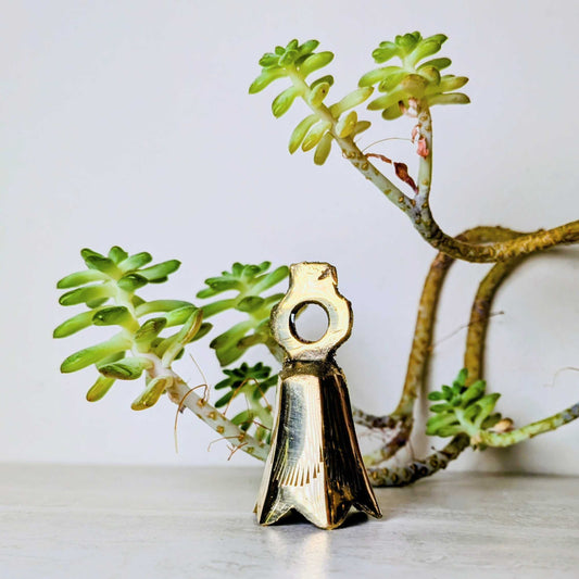 Handcrafted brass bell, one of six assorted designs, view 4, at Ordinary Magic in Savannah, GA.