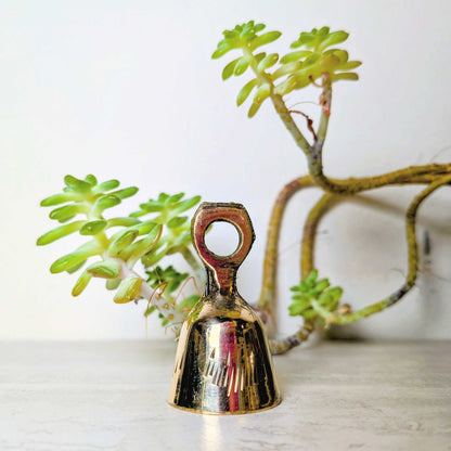 Handcrafted brass bell, one of six assorted designs, view 7, at Ordinary Magic in Savannah, GA.