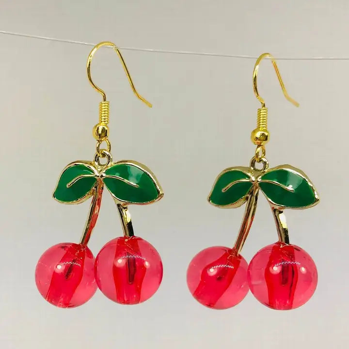 A pair of acrylic red cherry-shaped earrings.