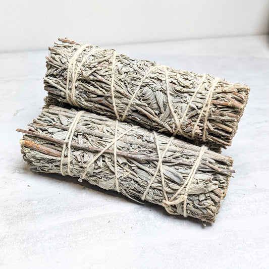 A bundled desert sage burn wand scented with copal.