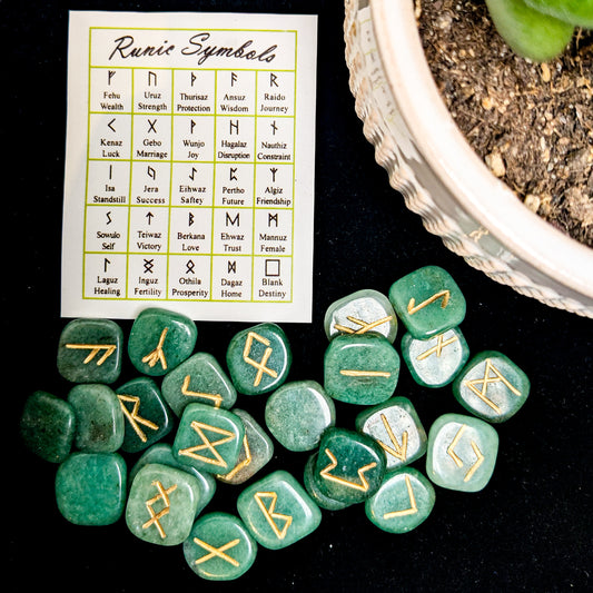 A set of polished crystal runes engraved with Elder Futhark letters, at Ordinary Magic in Savannah, GA.
