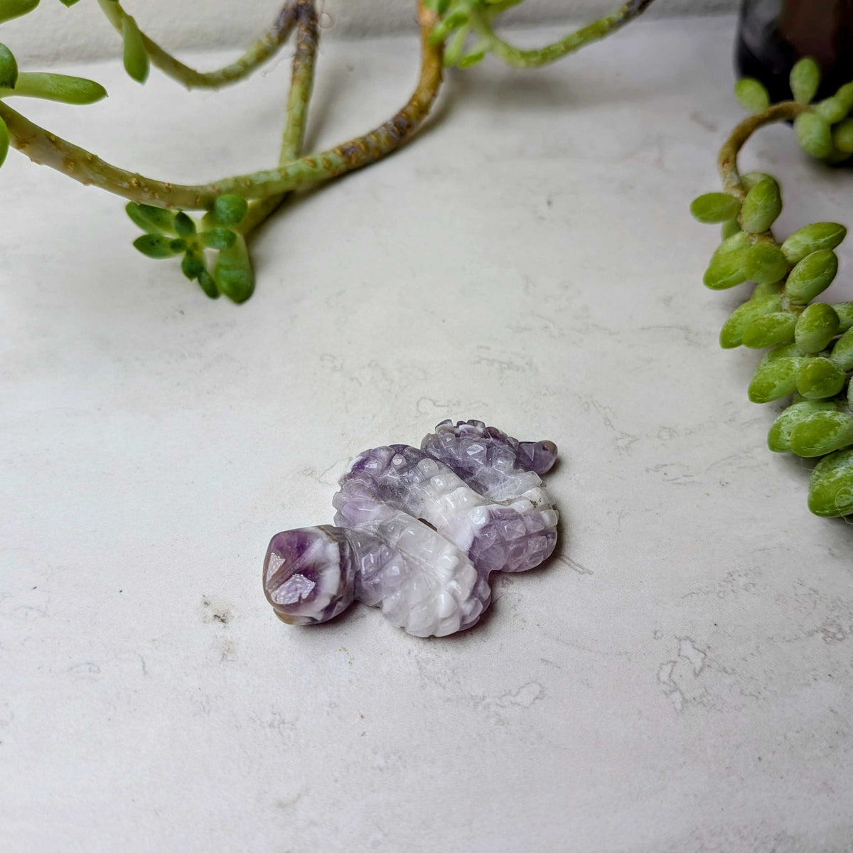 Carved crystal snake figure in chevron amethyst, at Ordinary Magic in Savannah, GA.
