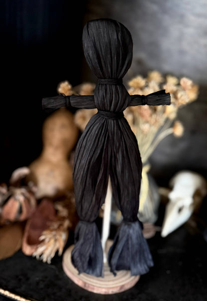 Black corn husk folk poppet, third view, at Ordinary Magic in Savannah, GA.