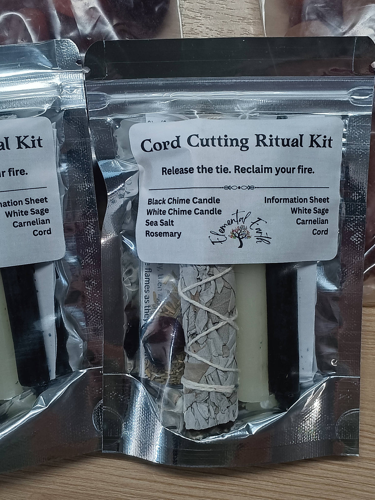 Cord cutting ritual kit with black and white chime candles, cord, carnelian, rosemary and sea salt, at Ordinary Magic in Savannah, GA.