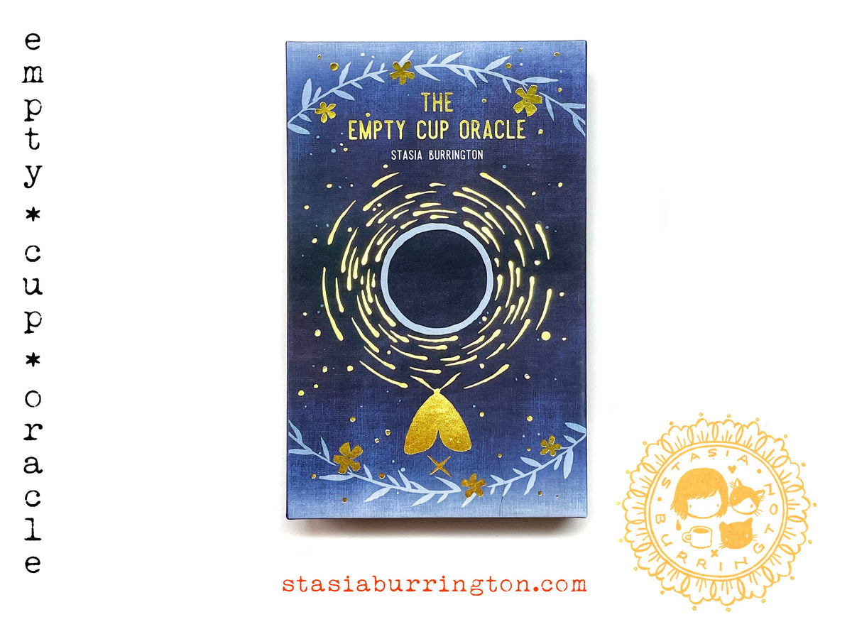 The Empty Cup Oracle deck by Stasia Burrington, illustrated oracle cards with gold-foil edges and lidded box, at Ordinary Magic in Savannah, GA.