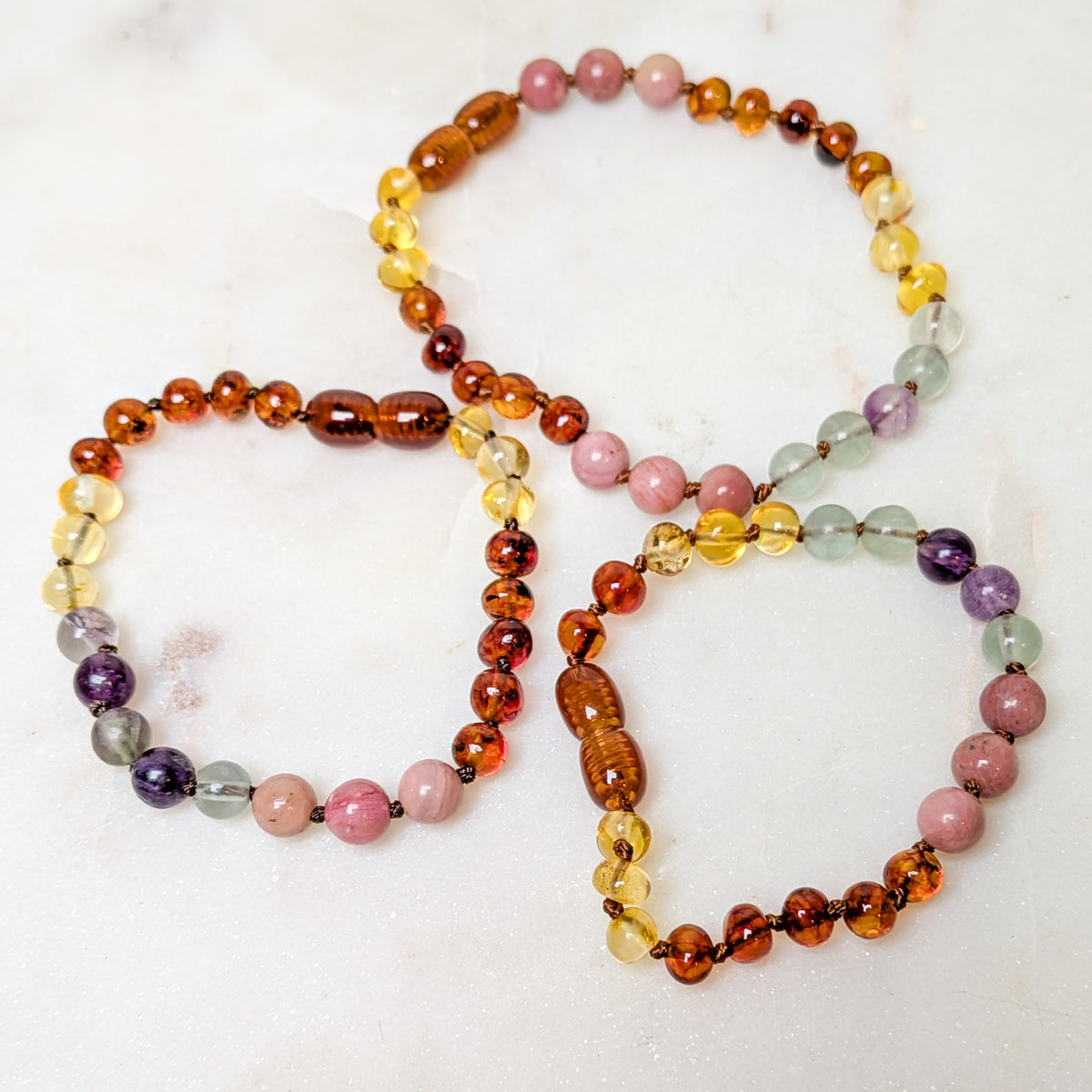 A raw Baltic Sea amber and rainbow stone anklet or bracelet.