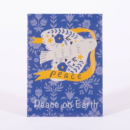 Card with a dove illustration and 'Peace on Earth' text on a blue floral patterned background