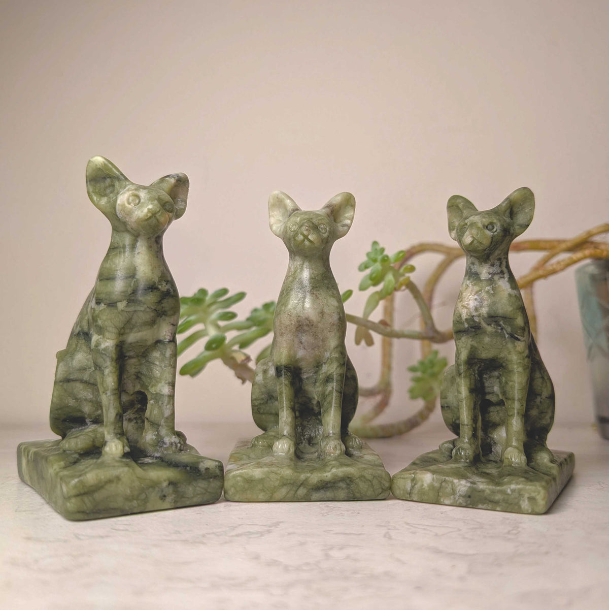 Hand-carved serpentine cat figure, at Ordinary Magic in Savannah, GA.