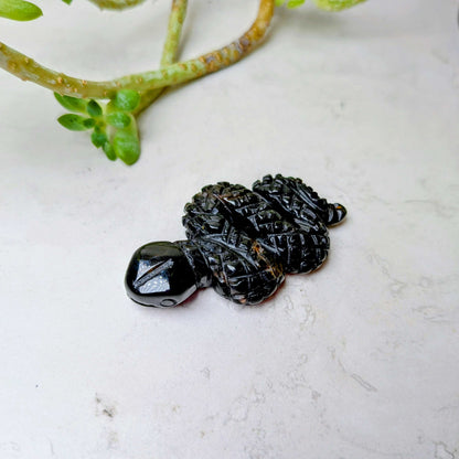 Carved crystal snake figure in black agate, at Ordinary Magic in Savannah, GA.