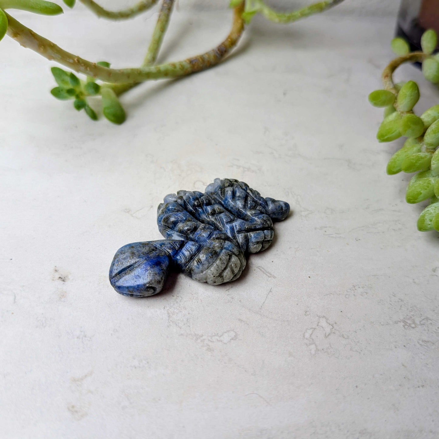 Carved crystal snake figure in lapis lazuli, at Ordinary Magic in Savannah, GA.