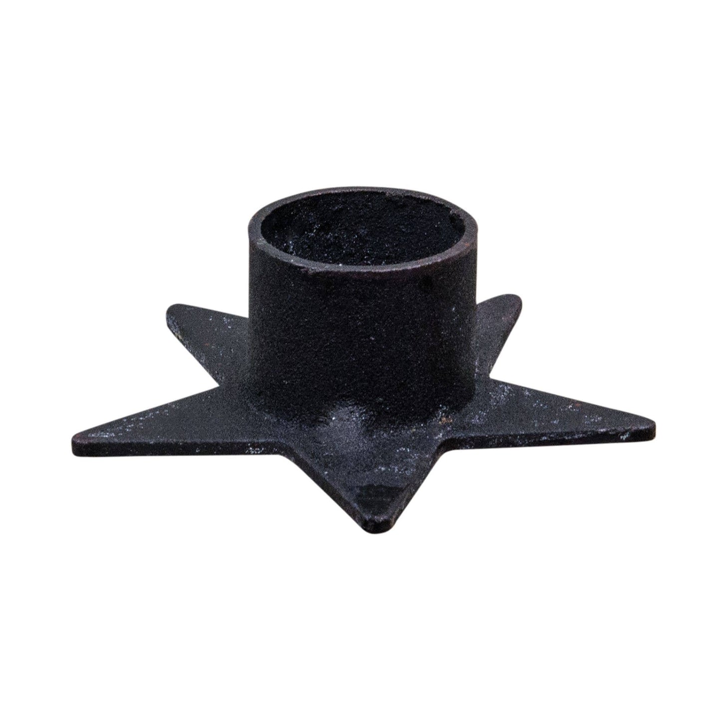 Star-shaped metal taper candle holder, at Ordinary Magic in Savannah, GA.