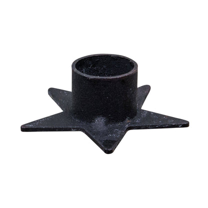 Star-shaped metal taper candle holder, at Ordinary Magic in Savannah, GA.