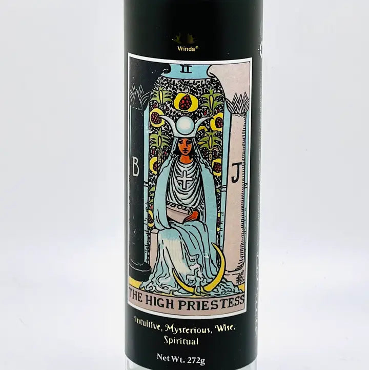 7 day tarot candles in tall glass jars printed with tarot card imagery, at Ordinary Magic in Savannah, GA.