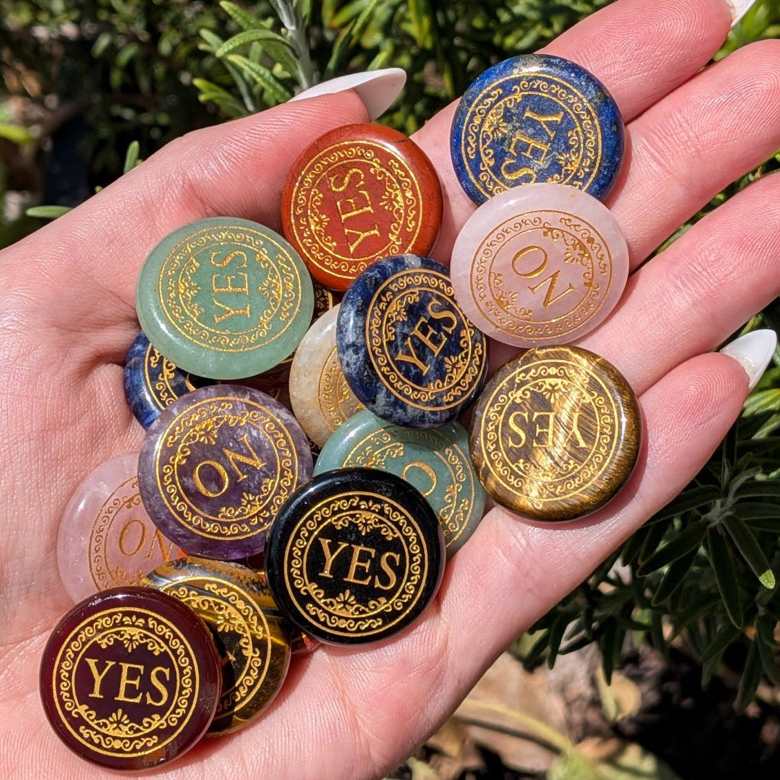 A crystal decision coin marked yes on one side and no on the other.